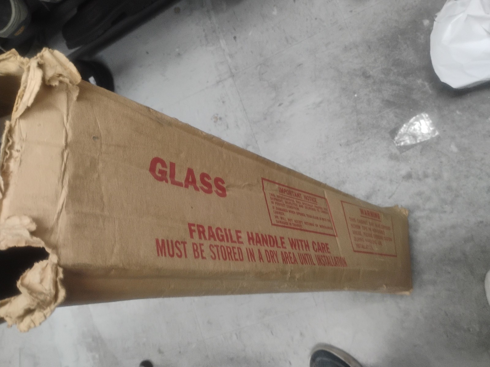 white fire extinguisher cabinet with a breakable glass panel