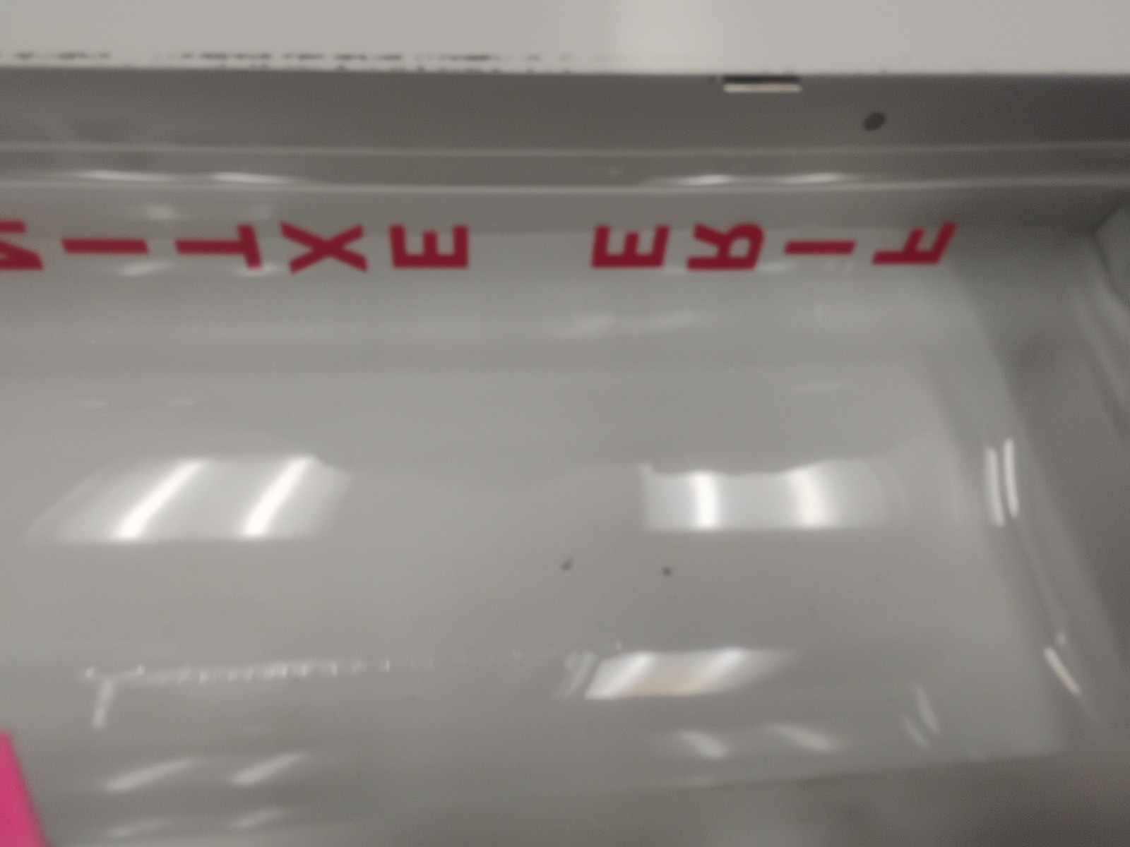 white fire extinguisher cabinet with a breakable glass panel