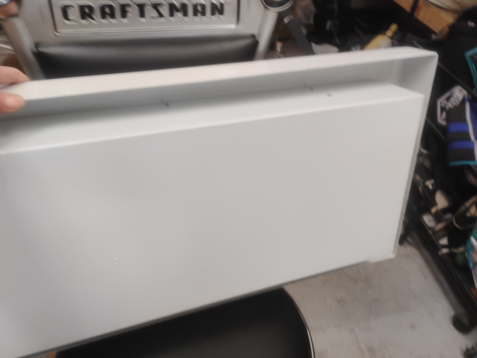 white fire extinguisher cabinet with a breakable glass panel
